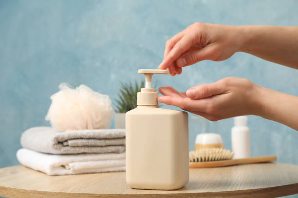 istock Female hands squeeze liquid soap. Personal hygiene concept 1221678078