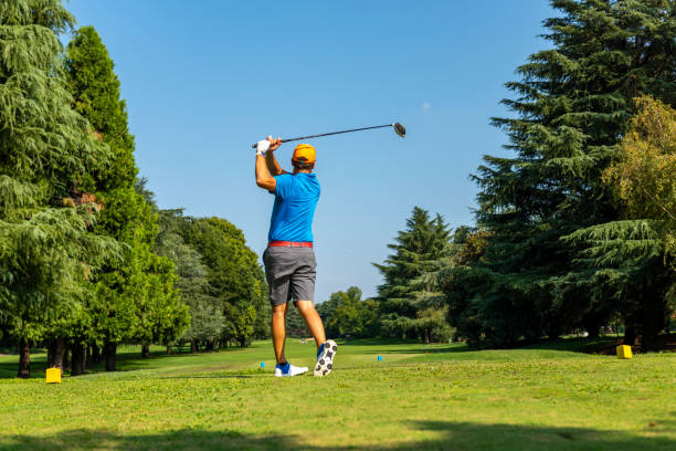 istock Close up Golfer is driving golf ball to green course 1221678743