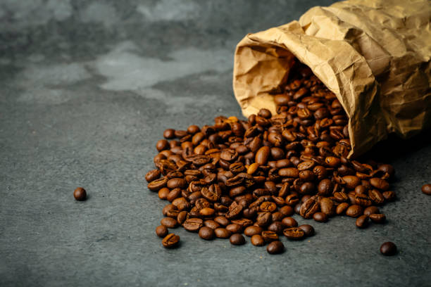 istock Coffee background. Roasted coffee beans on a dark background. Coffee banner for menu, design and decoration 1221680115