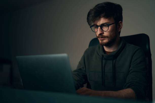 istock Young man working on computer at his workplace. Young business man working from home. 1221681089