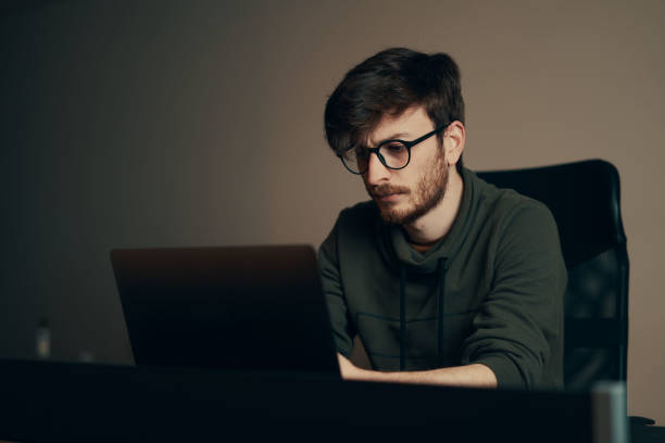 istock Handsome young man working from home. Many stuff to do today. man works as a freelancer. 1221681107
