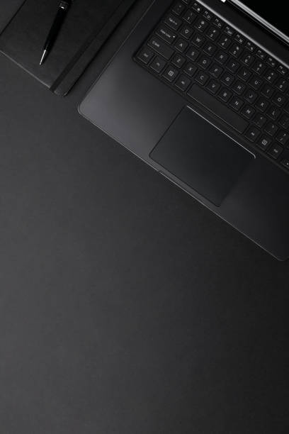istock Flat lay top view monochrome composition with laptop and notepad 1221682677