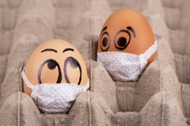 istock Eggs  wearing medical masks 1221682826