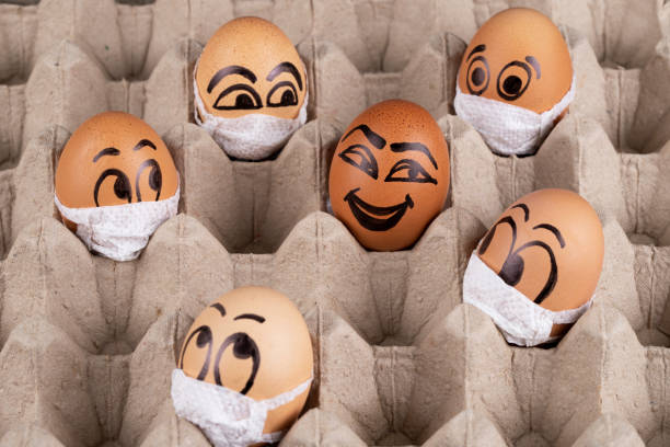 istock Eggs  wearing medical masks 1221682907