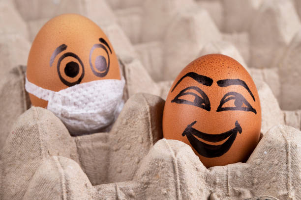 istock Eggs  wearing medical masks 1221683472