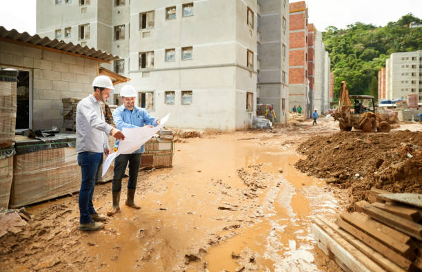 Reviewing the blueprint at the site