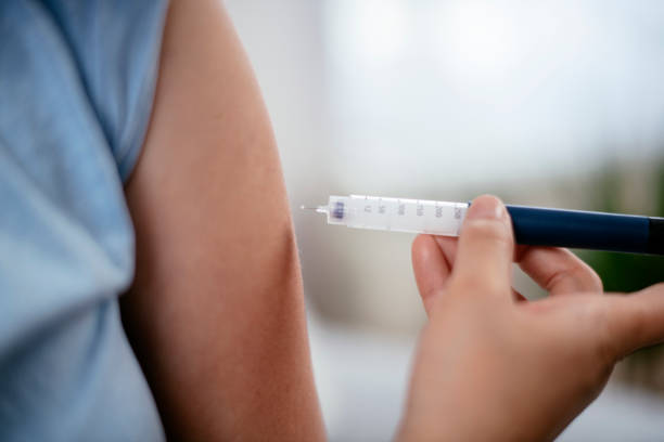 istock Injection with insulin pen stock photo 1221686637
