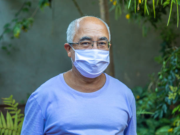 istock happy and smiling bald man with mask 1221686713