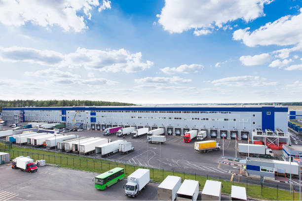 istock modern logistics center with different cargo truck 1221687600