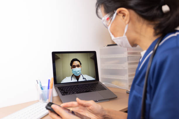 istock Female health care workers having video conference 1221688854