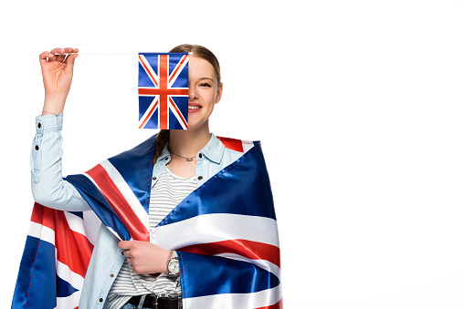 happy pretty girl with obscure face and uk flags isolated on white