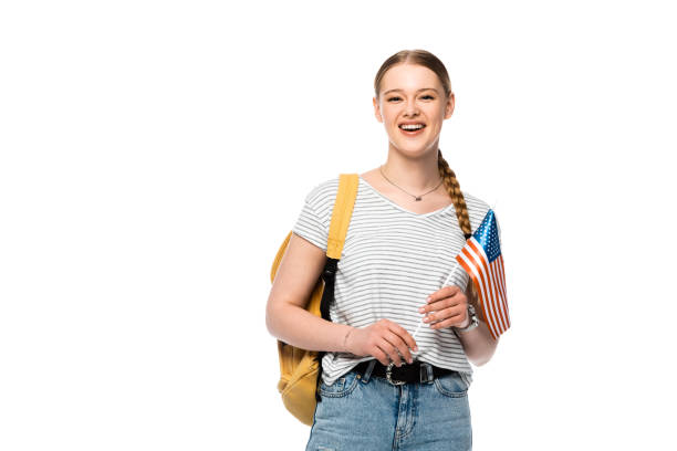 istock happy pretty student with backpack and american flag isolated on white 1221691002