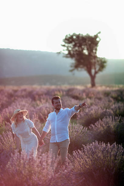 istock Beautiful couple walking in a lavender field 1221691214