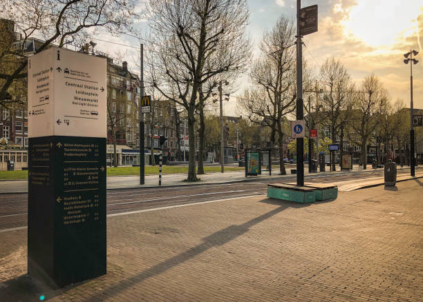 Amsterdam, The Netherlands - April 12, 2020: The otherwise crowded and tourist-infested Rembrandtplein on Easter Sunday 2020, now deserted due to the COVID-19 lockdown
