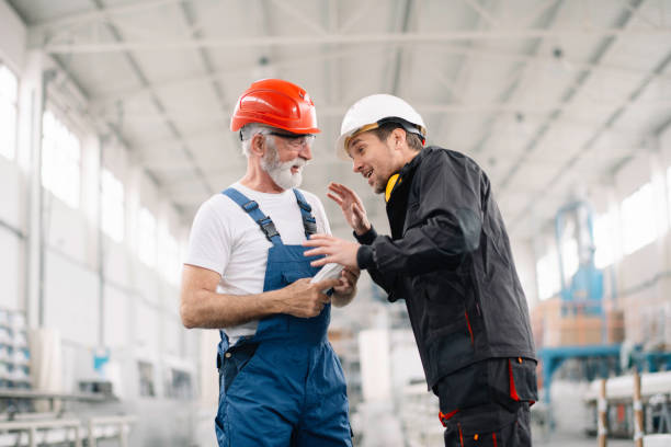 istock Colleagues working together. Workers in factory. 1221692662