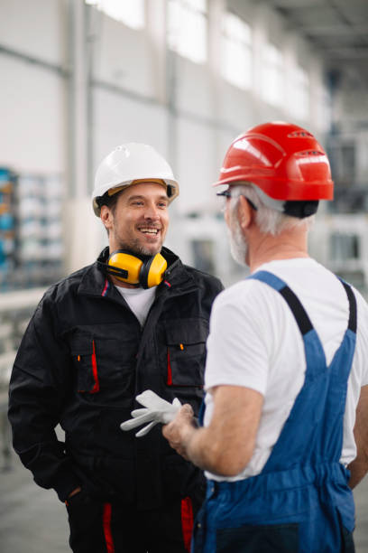 istock Colleagues working together. Workers in factory. 1221692822