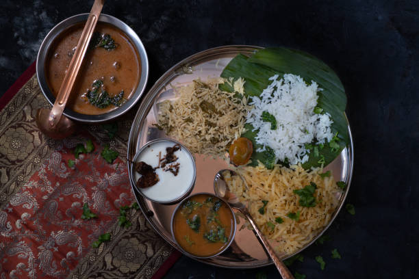 istock South Indian vegetarian  dishes served on platter with banana leaf 1221693589