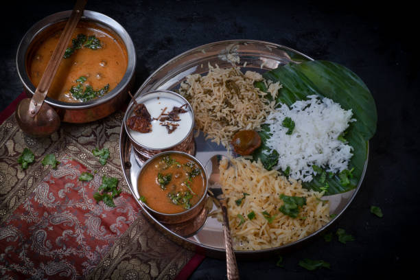 istock South Indian vegetarian  dishes served on platter with banana leaf 1221693592