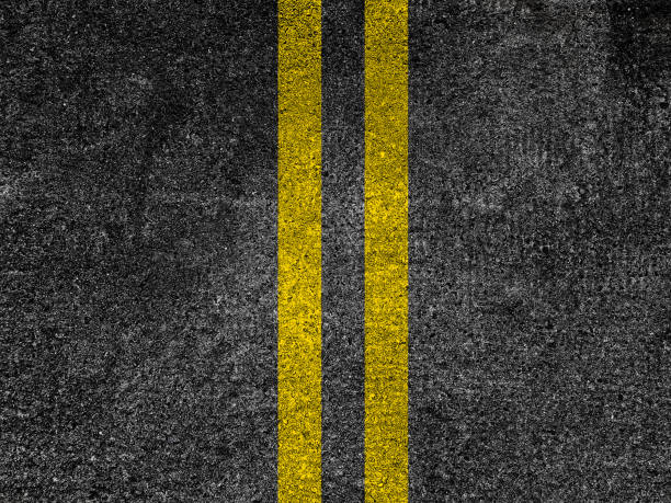 istock Asphalt road with double yellow lines 1221694806