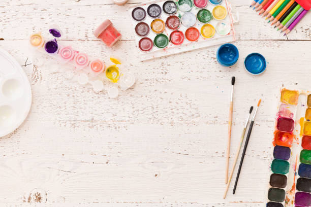 istock Directly Above on colorful paints, pencils and brushes. Creative ideas, creativity and early learning. Education concept. 1221695055