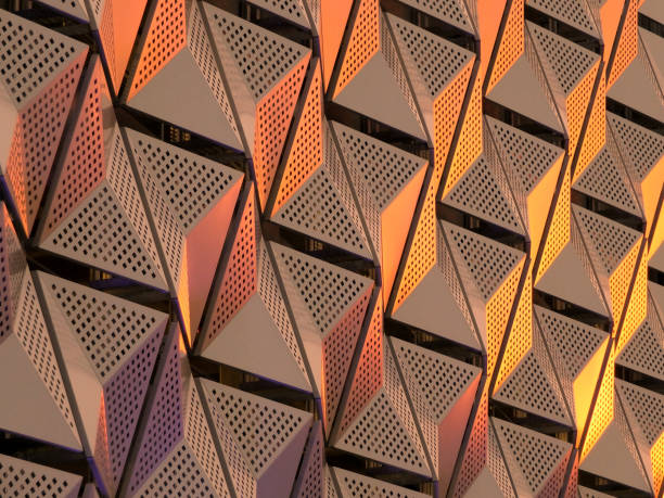 metallic geometric architectural abstract in copper and gold colors metallic geometric architectural abstract in copper and gold colors cladding construction equipment photos stock pictures, royalty-free photos & images