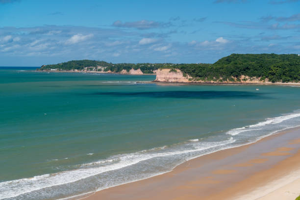 istock With its cliffs and natural vegetation, this beach attracts tourists from all over the world 1221696065