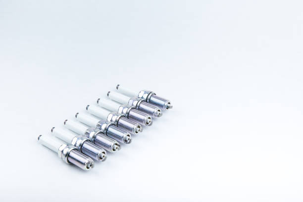 istock eight spark plugs on white background with copy space top view. 1221698699
