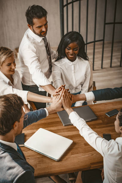 istock High Five Gesture Of Business Team At Meeting 1221698866
