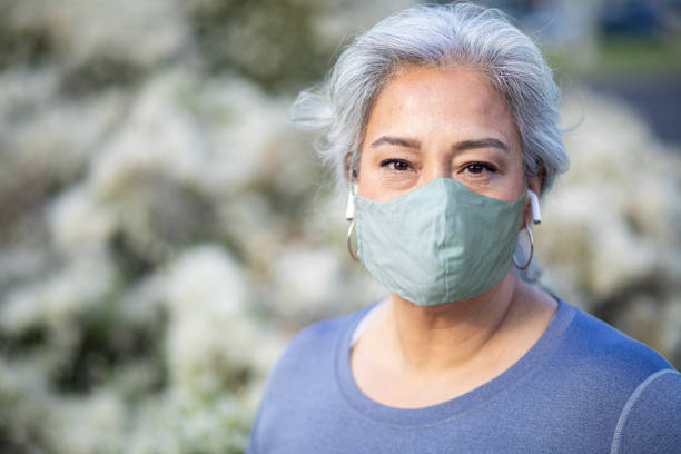 Portrait of a beautiful Mexican Woman Wearing a Mask A portrait of a beautiful senior Mexican woman diabetes epidemiology stock pictures, royalty-free photos & images