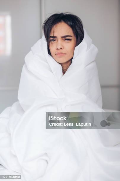 Monday Morning Beautiful Young Dissatisfied Woman Wrapped In Blanket Sitting On Bed Stock Photo - Download Image Now