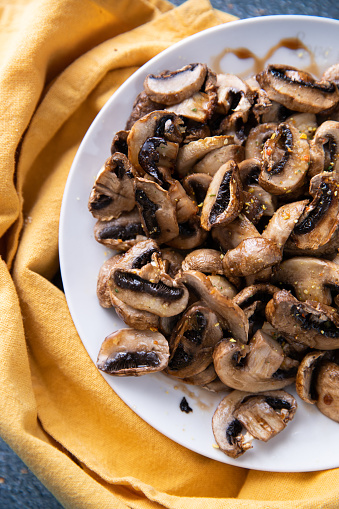 Autumn forest raw mushrooms Armillaria mellea in a plate before cooking