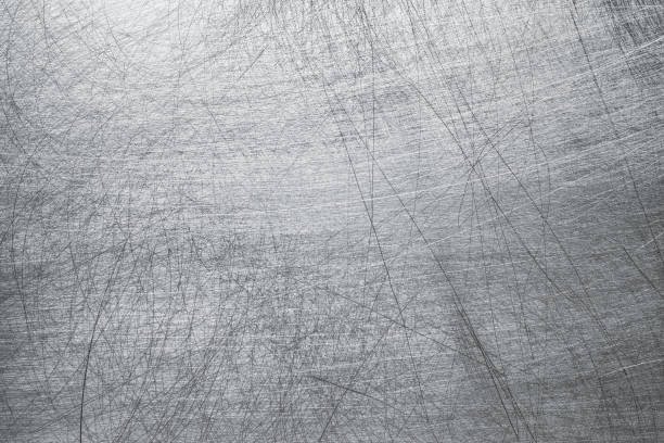 istock Crumpled metal texture, stainless steel background with mechanical damages 1221708219