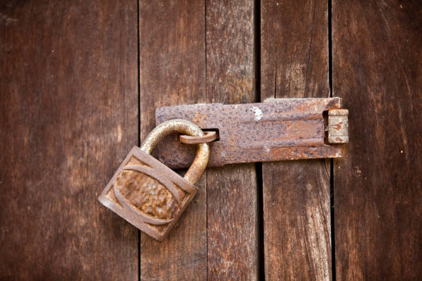 istock old rusty door lock on wooden door 1221709801