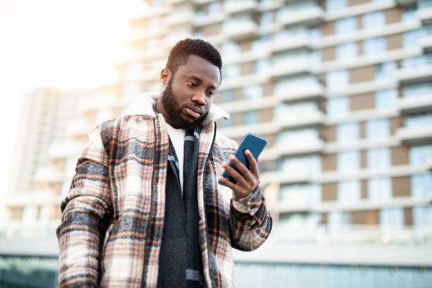istock Young man typing message on the phone. 1221711889