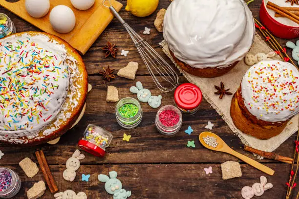 Easter cake decoration. Icing-sugar, topping, edible beads. Natural healthy ingredients, vintage wooden table