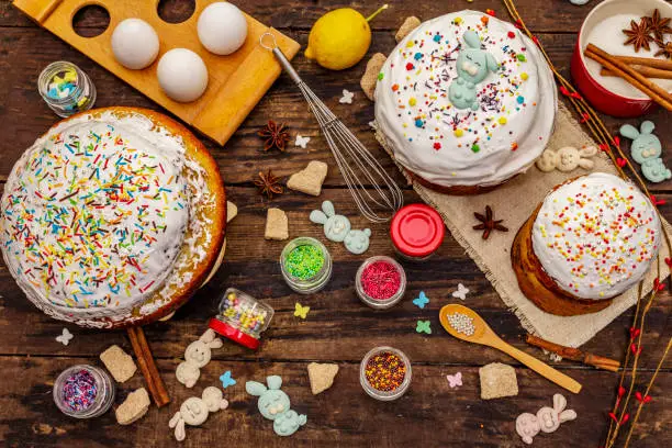 Easter cake decoration. Icing-sugar, topping, edible beads. Natural healthy ingredients, vintage wooden table