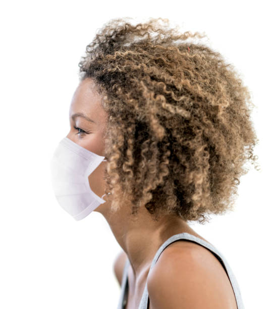istock African American woman wearing a facemask to avoid the coronavirus 1221713785