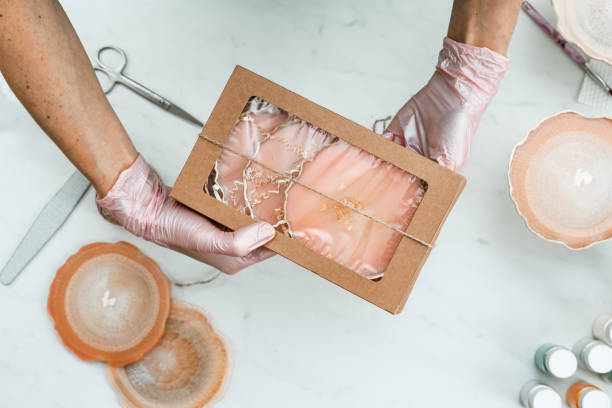 istock Creativity and craft. A young girl creates coasters from resin. Gift wrapping. Decorative packaging. Idea for business. Remote work, work at home. Art coasters. 1221713967
