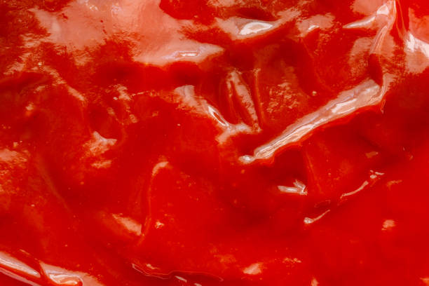 istock Tomato sauce ketchup texture background close up 1221714051