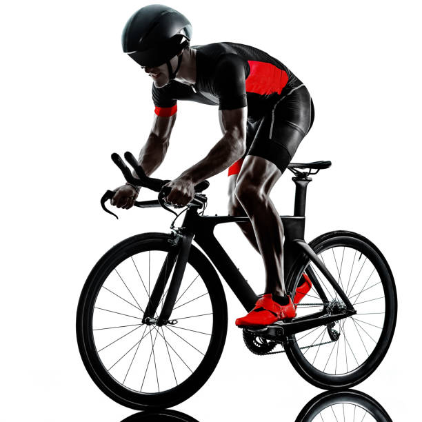 istock triathlete triathlon Cyclist cycling silhouette isolated white background 1221719725