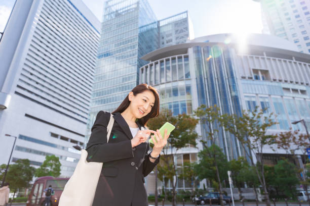 istock asian woman who see a smart phone 1221720663
