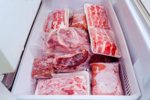 Flat layout of red meat package piles inside a box stock photo