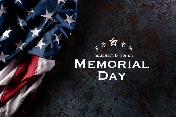 Happy Memorial Day. American flags with the text REMEMBER & HONOR against a black stone texture background. May 25.