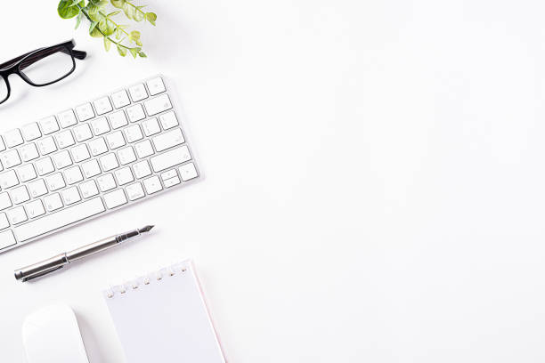 istock Flat lay, top view office table desk. Workspace with keyboard, office supplies and pencil  with copy space on white background. 1221727815