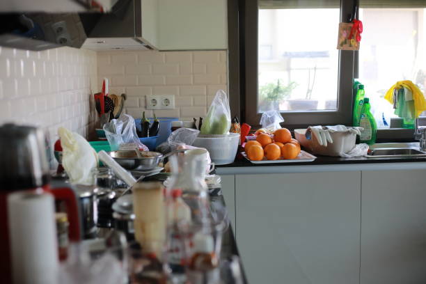 istock Messy kitchen with pile of dirty dishes, organization before and after 1221729781
