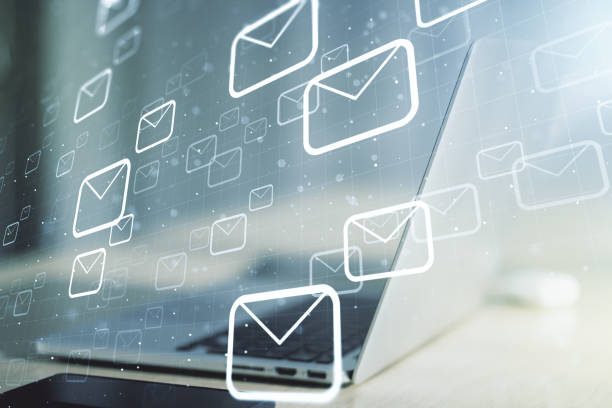 istock Creative abstract postal envelopes sketch on modern laptop background, e-mail and marketing concept. Double exposure 1221731472
