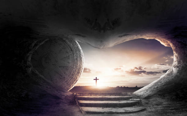 istock Easter Sunday concept: Tomb empty with cross on sunset background 1221732344