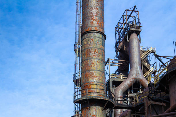 istock Labyrinth of rusted metal structures, old abandoned steel mill, ample blue sky copy space 1221732467