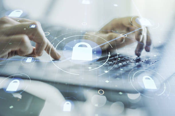 istock Creative idea concept with lock symbol and microcircuit illustration and hands typing on laptop on background. Protection and firewall concept. Multiexposure 1221734388