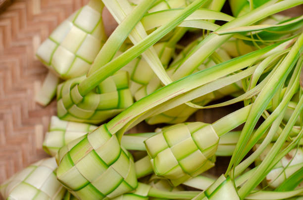 istock ketupat casing and rice in bamboo container. traditional malay delicacy during Malaysian eid festival 1221736867